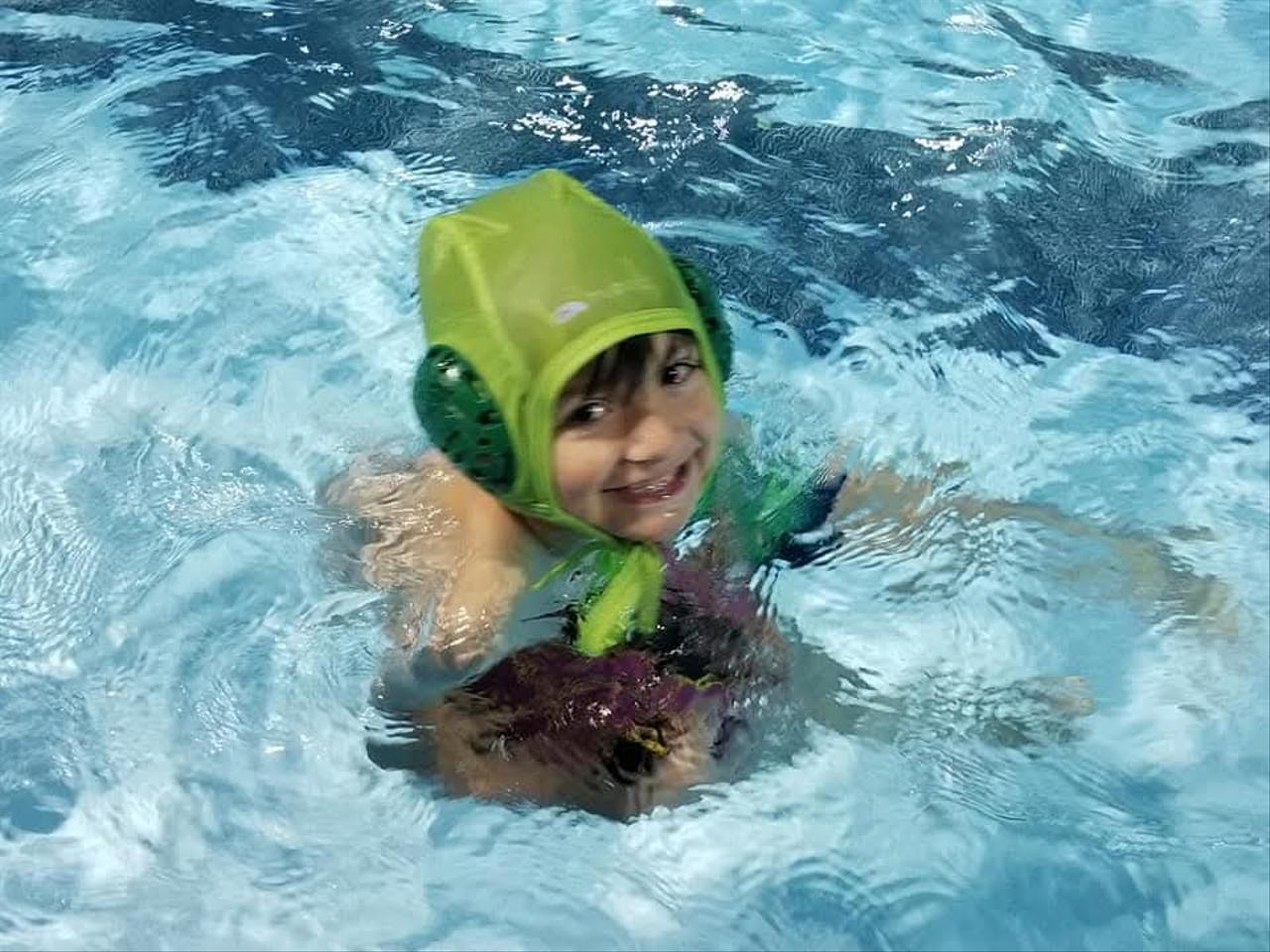 A young Simon beginning his water polo journey